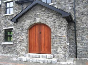 Grand front door in Highland Stone Blue profile stone cladding example
