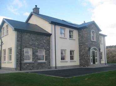 Rendered and stone clad house in the Highland Stone Blue profile